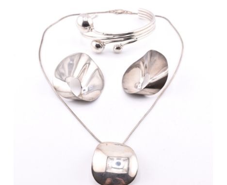 A hallmarked silver bangle and a Modernist silver necklace and earring set. The lot to include a hallmarked silver cuff bangl