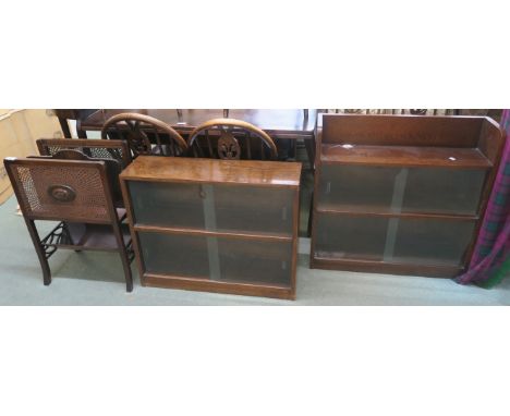 Two dark oak bookcases with glass sliding doors and a magazine rack with cane sides and lower book trough (3) Condition Repor