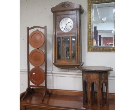 A small octagonal Moorish table, wall clock and cake stand (3) Condition Report: Available upon request