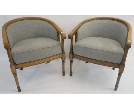 A pair of light oak armchairs with grey tweed upholstered seats and back (2) Condition Report: Available upon request