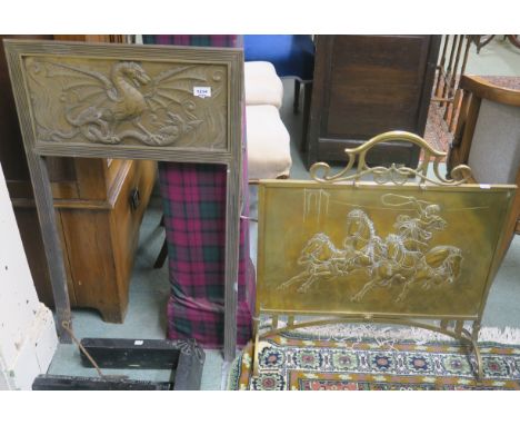 A brass firescreen depicting chariot racing and a brass fire surround depicting dragons (2) Condition Report: Available upon 