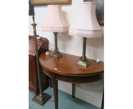 A brass Corinthian column standard lamp and a pair of matching brass table lamps (3) Condition Report: Available upon request