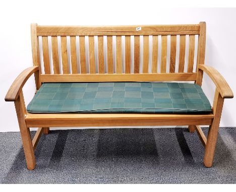 A contemporary heavy teak garden bench, W. 138cm