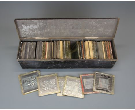 A Victorian Tolle Ware box of magic lantern slides.
