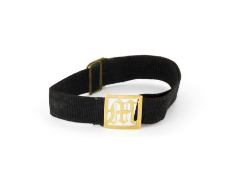 A Victorian ribbon mourning bracelet with a 9ct gold initial 'M' and 9ct gold clasp, approx. L. 20cm.
