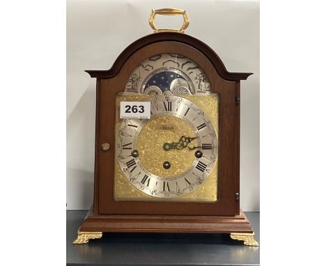 A Hermle moonphase chiming mantle clock, H. 30cm.