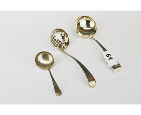 A Georgian hallmark silver ladle and two further ladles.