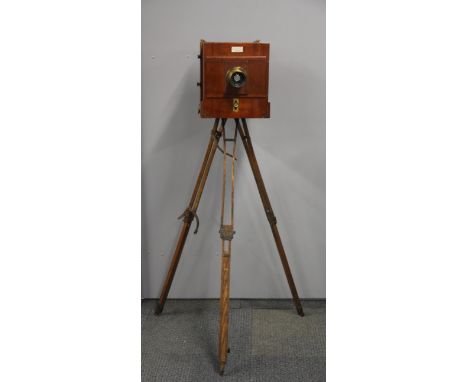 A Sands and Hunter full plate mahogany camera with brass bound portrait lens, tripod and three mahogany dark slides, 46 x 26 