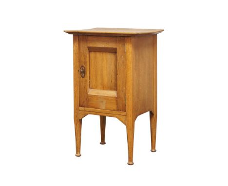 An Arts and Crafts oak bedside cabinet manufactured by Lebus, Louis & Harris, c.1905, stamped to reverse 'H697',The rectangul