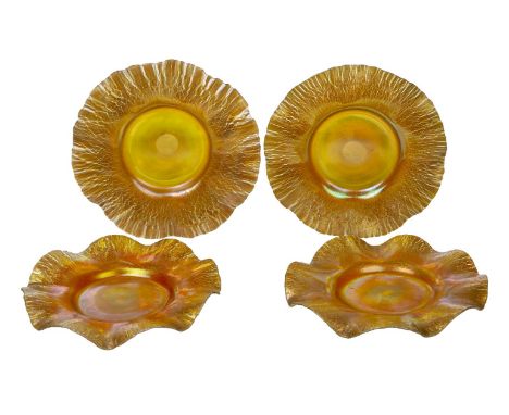 L.C. Tiffany (American), a set of four iridescent glass dishes,Early 20th century, engraved L.C.T, ground out pontil,Each wit