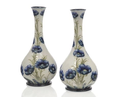 William Moorcroft (British 1872-1945), a pair of Macintyre  ‘Florian Ware’ Poppy design ceramic vases,c.1903-1904, printed Ma