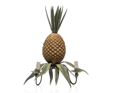 A polychrome painted metal pineapple wall light,c.1960,Modelled as a pineapple with leaves, having two curved sconce arms eac