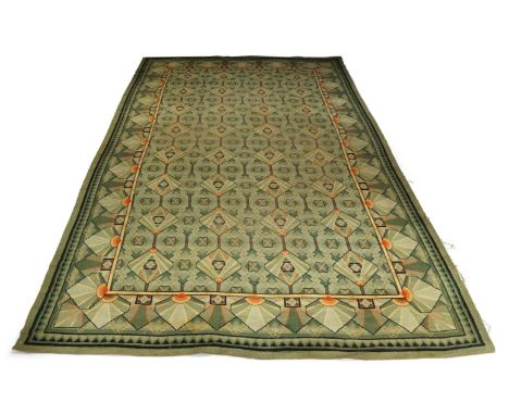 An Art Deco carpet, English school, c.1930,Machine woven, with repeat geometric motifs in a green field, 274cm x 445cm Please