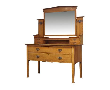 An Arts and Crafts oak dressing table manufactured by Lebus, Louis & Harris,c.1905, locks stamped 'L.L.H',The rectangular top