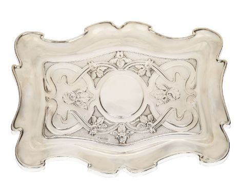 An Art Nouveau Chester silver card tray,Mark of William Neale, Chester 1901, Rd. 376331,Of shaped outline, embossed with sinu