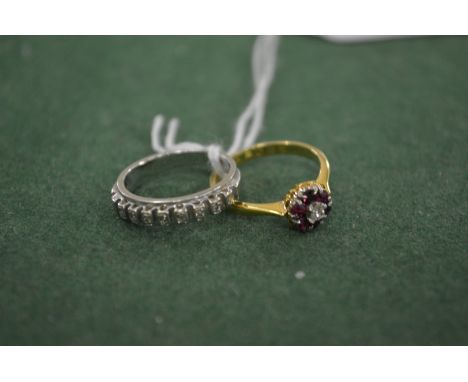 An 18ct white gold and diamond hoop ring together with an 18ct yellow gold, diamond and ruby ring.