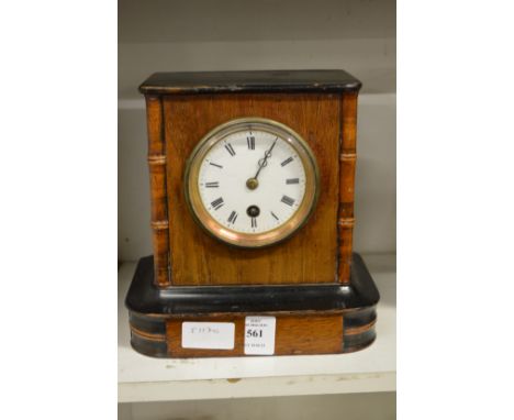A small walnut mantle clock.