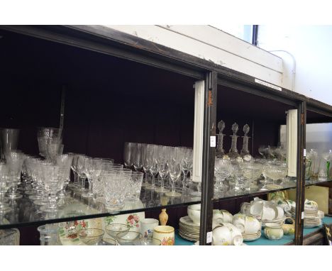 A large shelf of glassware.