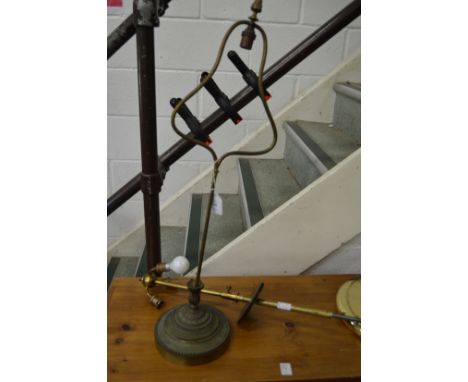 A brass lamp base and a similar item.