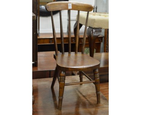 A child's stick back chair.
