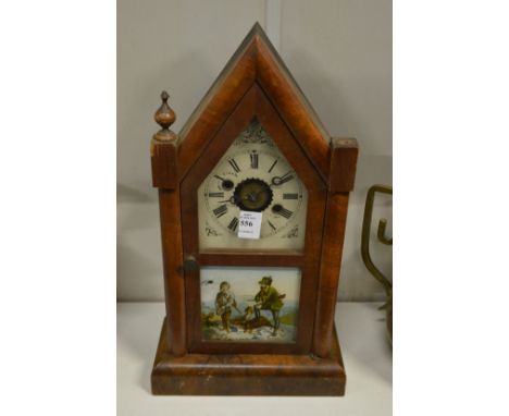 An American walnut cased mantle clock.