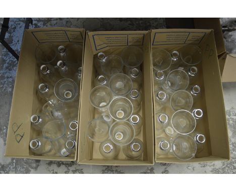 Three boxes of clear glass light shades.