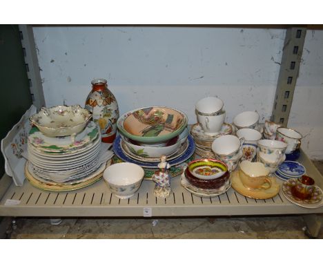 A shelf of decorative china.