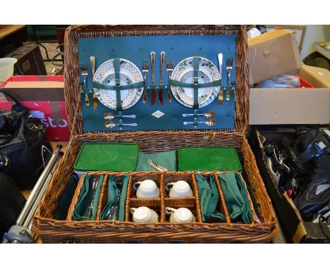 A good wicker hamper with contents, appears little or unused.