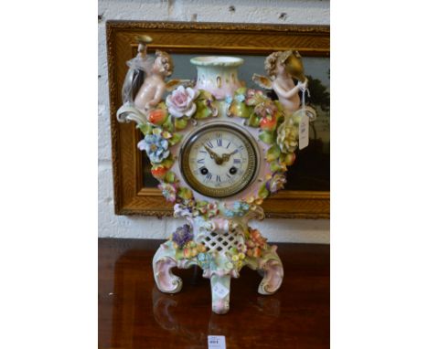 A Dresden porcelain mantle clock.