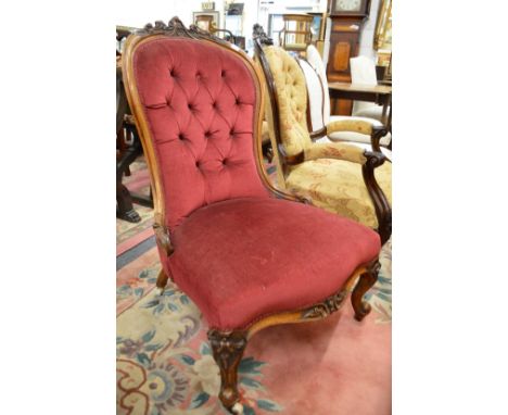 A Victorian rosewood framed button upholstered nursing chair.