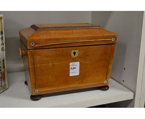A satinwood tea caddy.
