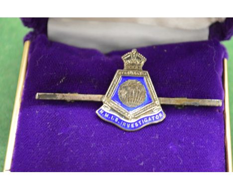 A silver and enamel bar brooch HMIS Investigator.