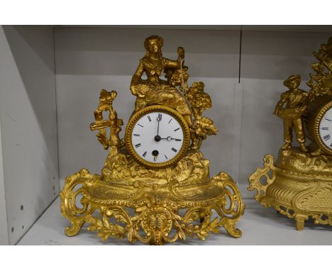 A French gilt metal mantle clock.