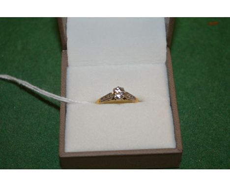 An 18ct gold, platinum and diamond solitaire ring.