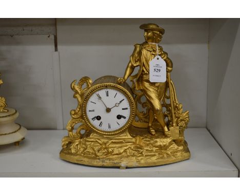 A decorative French gilt metal mantle clock.