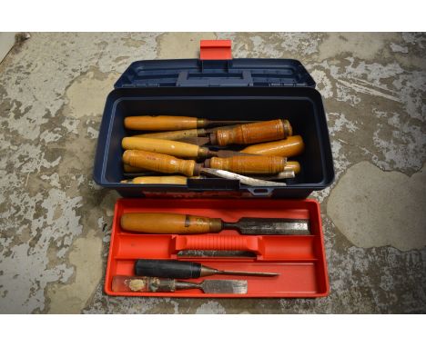 A tool box containing chisels.