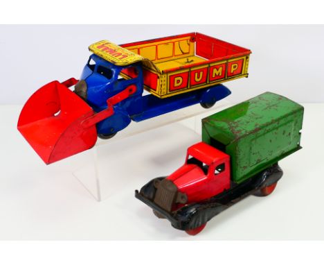 Marx - Two vintage vehicles to include: A Marx Toys Dump Truck "Lumar Construction Company" with red scoop/bucket to front, b