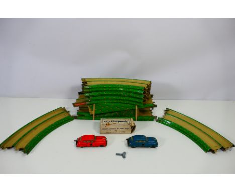Marx - An unboxed tinplate clockwork Marx Speedway with 2 x cars. It has 12 x curves, 2 x straight sections and 2 x bridge se