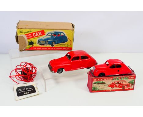 Chad Valley -  2 x boxed clockwork/remote control cars to include: A Chad Valley remote control car with rubber squeeze butto