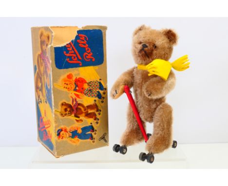 Schuco clockwork - A clockwork mechanism, Schuco Rolly teddy bear on roller skates. Made in US Zone Germany DBGM. Clipped muz