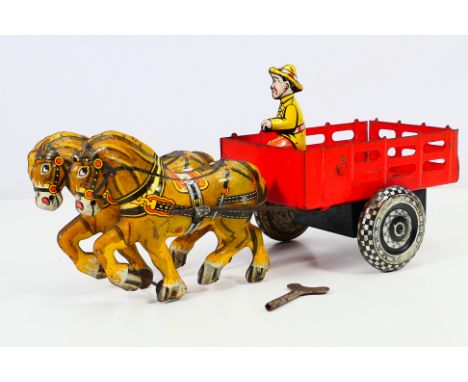 Marx - A vintage Marx Toys clockwork tin plate cart and two horses. Lithograph printing detail, red cart. Comes with key and 