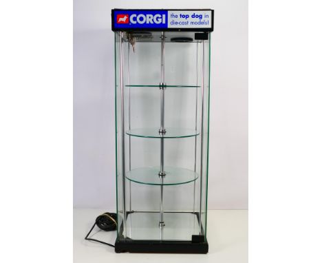 Display Cabinet - A glass cabinet with motorised turning central display and lighting. It measures 77 cm tall x 31 x 31 and a