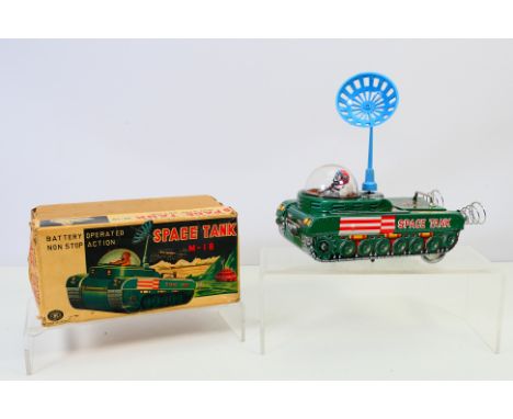Modern Toys, Tin Plate - A boxed Modern Toys battery operated Space Tank M-18. Comes with plastic attachment aerial. Battery 