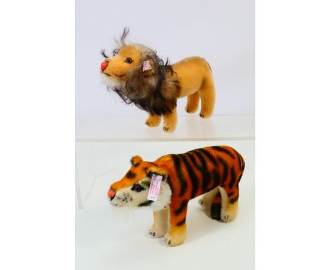 Steiff - Two Steiff animals: Lion and Tiger. Approx 16 cm & 19 cm long. White ear tags and card chest tag. Toys appear to be 