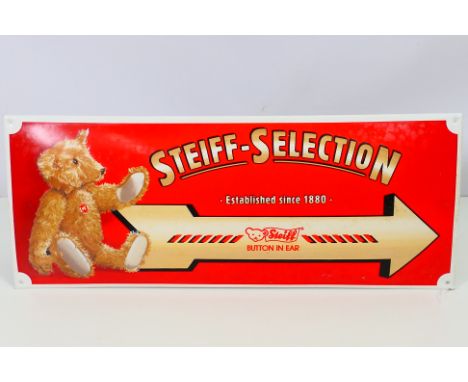 Steiff - A metal Steiff sign with the wording "Steiff - Selection. Established since 1880. Button in ear" pointing to the rig