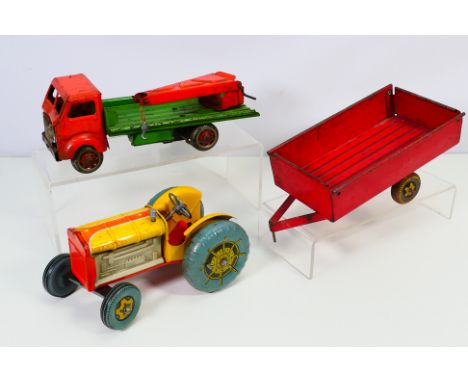 MetToy - Two clockwork Mettoy vehicles to include: A Tractor and trailer. Tractor in yellow, orange, trailer in red. No key. 