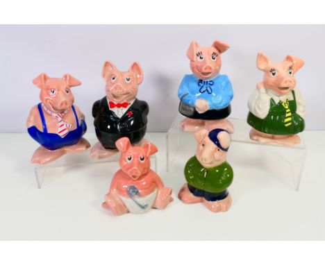 Wade - Nat West - A collection of five Nat West Pigs and one further ceramic pig with green top and blue cap. They all appear