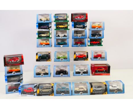Oxford and Cararama - 33 boxed 1/72 scale diecast model motor vehicles in plastic display cases; all appear in mint condition