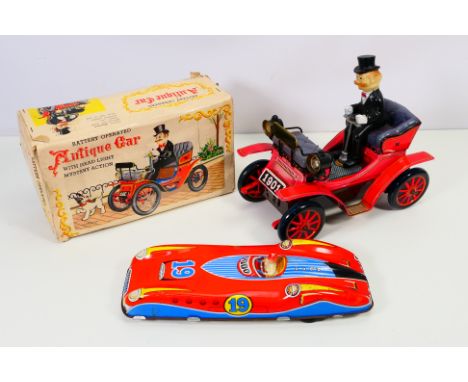 Showa - Two Vintage vehicles to include: A part boxed Showa (Japan) Battery operated "Antique Car with head light mystery act