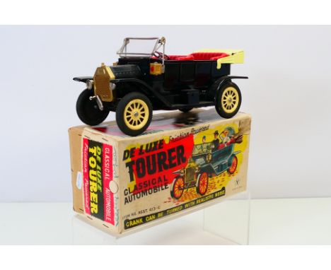 Yonezawa - A boxed Yonezawa (Japan) friction powered De Luxe Tourer Classical Automobile. Item No Asst 413-C. The toy appears